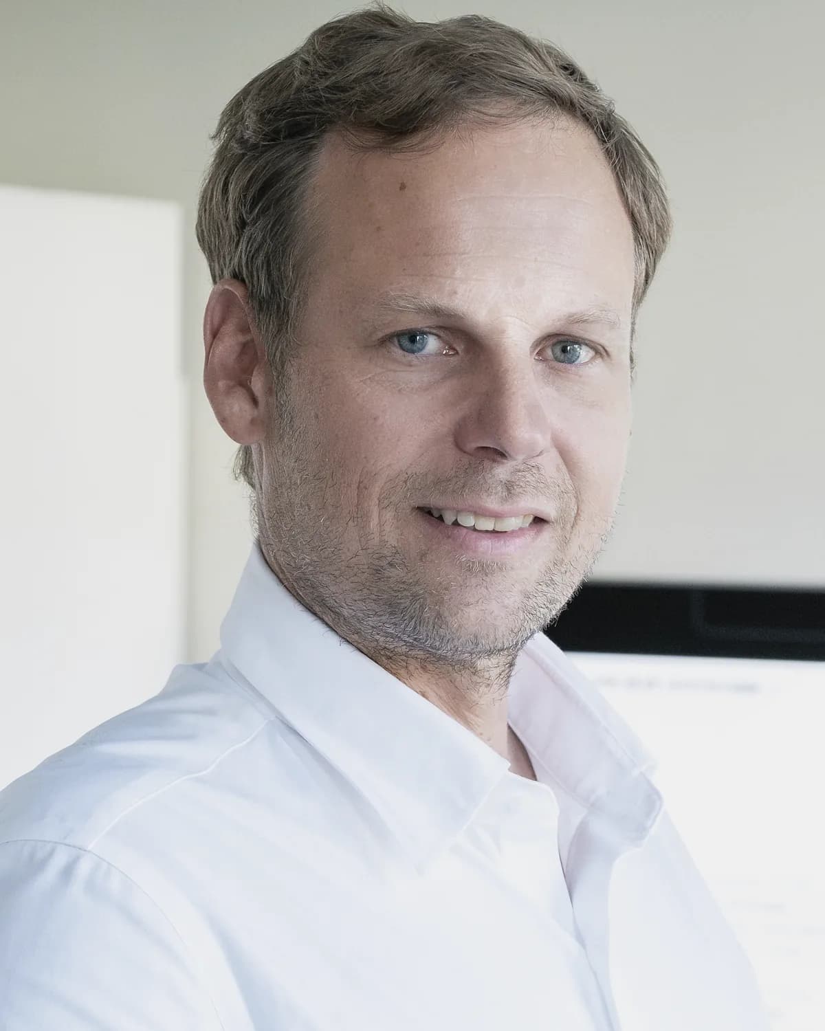 Stéphane Schwander, founder of EvidenSe, at work in his office